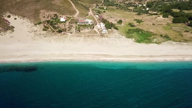 Aerial dorne bird's eye view video of iconic beach of Potami or River with turquoise clear waters, South Evia island, Greece