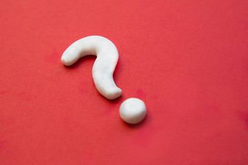 White question mark sign on red background