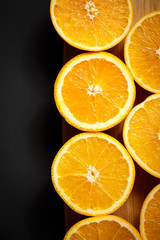 cut orange on wooden background