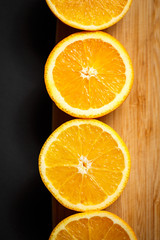 cut orange on wooden background