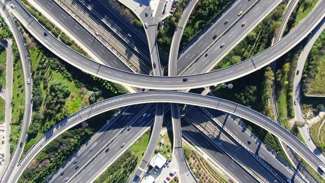 Aerial drone video of urban elevated toll road junction and interchange overpass in National road and Attiki odos of Attica, Athens, Greece