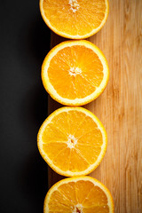 cut orange on wooden background