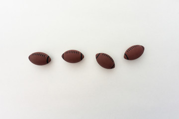 Four tennis balls composition on white background. Top view.