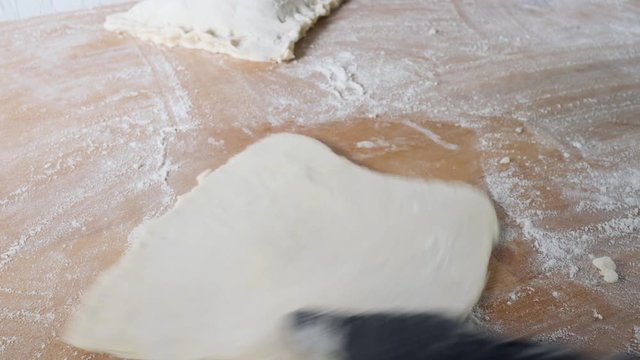 Chef hands work with dough prepares sweet pastries