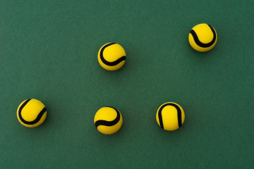 Tennis balls on green background. Top view.