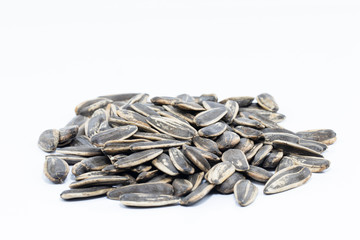 pile of sunflower seeds isolated on white background
