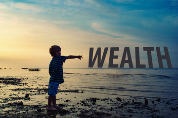 child points to the text of the wealth on the sunset background