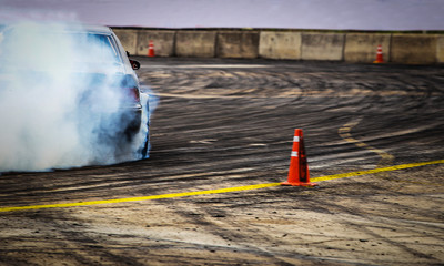 Blurred Race car drifting on speed track on twilight background. © jamesboy
