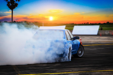 Blurred Race car drifting on speed track on twilight background. © jamesboy