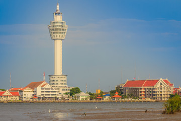 Fototapeta na wymiar Riverfront view of Samut Prakan city hall with new observation tower and boat pier. Samut Prakan is at the mouth of the Chao Phraya River on Gulf of Thailand.
