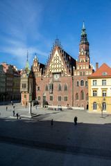 Fototapeta premium City hall with tower on main Wroclaw square, touristic season, sunny and blue sky