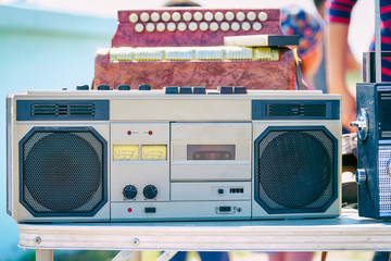 Old cassette recorder of silver color on the table
