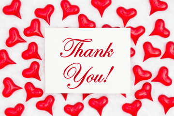 Thank you greeting card with red hearts on white fabric