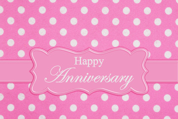 Happy Anniversary greeting on bright pink and white polka dot fabric