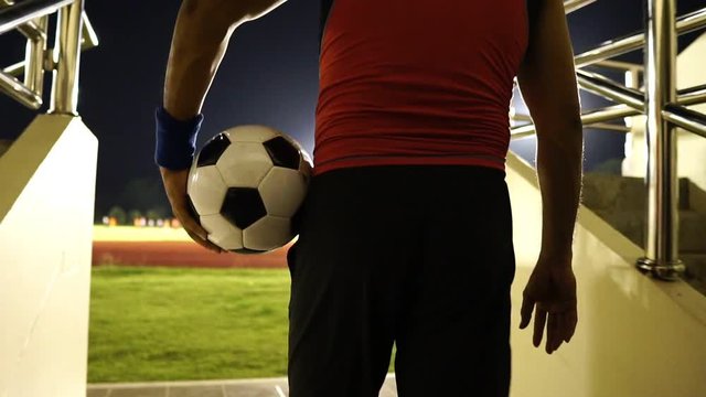 Soccer players are entered in the football stadium for the match footage slow motion