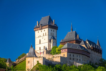 View of Karlstejn royal castle at sunny day,  located near of Prague, Czech Republic, Europe.