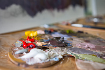 Colorful oil paints on palette.
