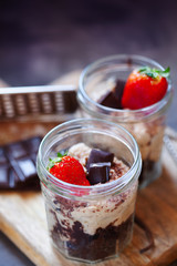 Cashew and dates vegan tiramisu with chocolate in portion jars. Healthy dessert