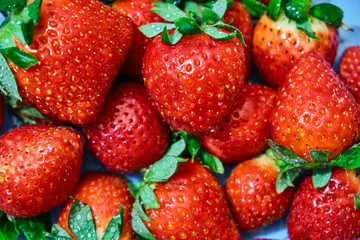 Ripe red strawberries on wooden table