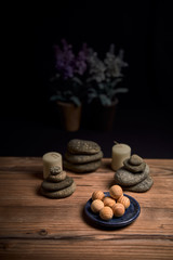 composition of candles, stones and wooden spa balls
