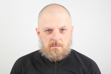portrait of a bearded man on a light background