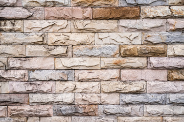 Stone wall texture background of grey brick stones.