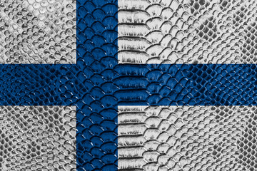 Fototapeta na wymiar Finland flag on reptile skin
