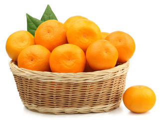 Fresh tangerines in a basket isolated on white