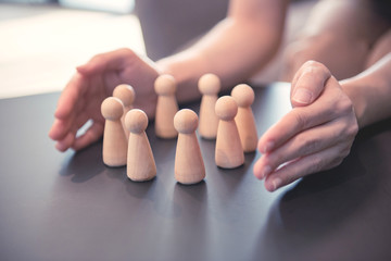 Woman hands defending his team with a gesture of protection, Security and safety in a business team.