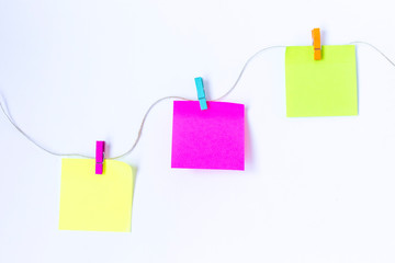 colorful sticky notes on a line'