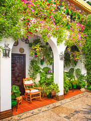 Naklejka premium Nice patio with flowers and pond in Cordoba, Spain