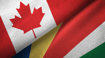 Fototapeta na wymiar Canada and Seychelles two flags textile cloth, fabric texture