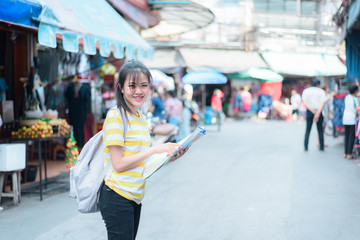 A woman is looking at a map for traveling,traveling in Thailand,traveling in Chiang mai