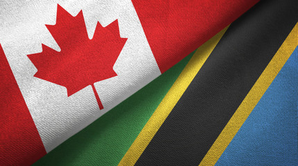 Canada and Tanzania two flags textile cloth, fabric texture