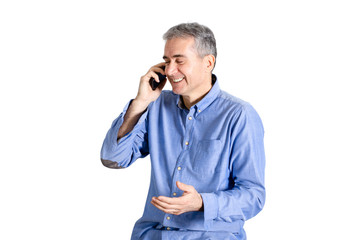 Older man enjoying phone conversation and smiling