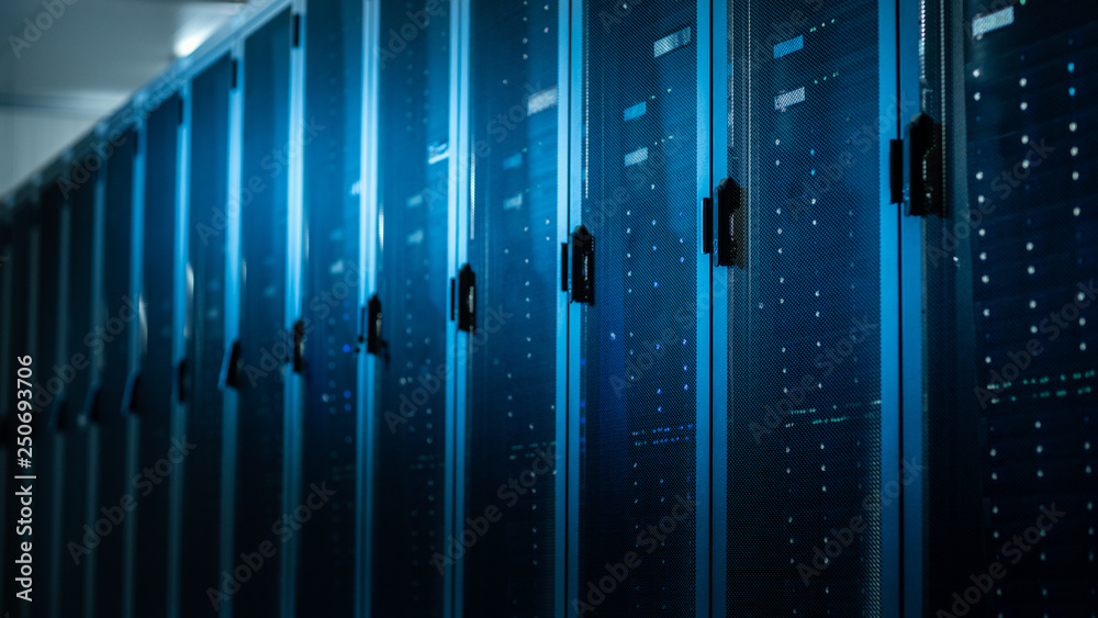 Poster Low Angle Shot of a Working Data Center With Rows of Rack Servers. Led Lights Blinking and Computers are Working.