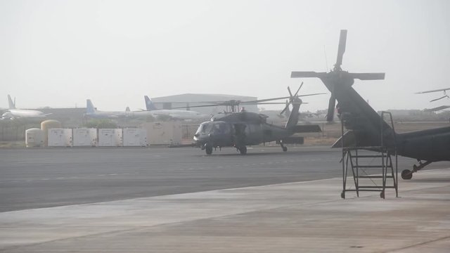 Army helicopter ending its landing on base