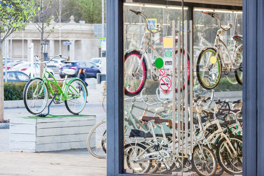 bicycle rental on the city street shop - Powered by Adobe