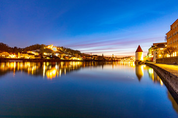 Fototapeta na wymiar river inn view at Passau in Bavaria with reflection of promenade by night