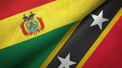 Fototapeta premium Bolivia and Saint Kitts and Nevis two flags textile cloth, fabric texture