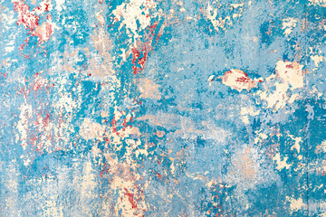 old wall with removed wallpaper and rest of paint