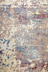 old wall with removed wallpaper and rest of paint