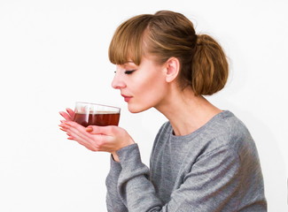 Young woman drinking tea