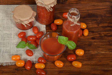 fresh tomato juice with basil in a glass with free space for text