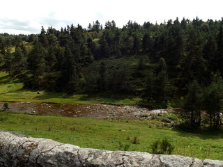 landscape in the mountains with a river