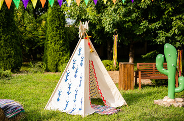 Wigwam decorations. Decoration for holiday party. Summer sunny hot day © Lena May