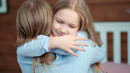 Medium close-up little baby girl rushing to hugging her mother having positive emotion