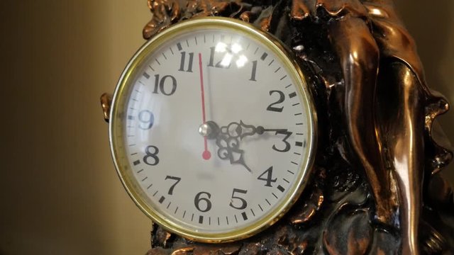 Sepia old fashioned antique western roman clock ticking slowly by Angle 2