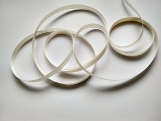 White ribbon close up on white background