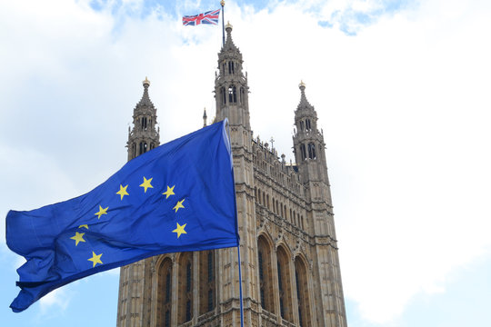 E.U. Flag flying in front of Union ack flag at Houses of Parliament London